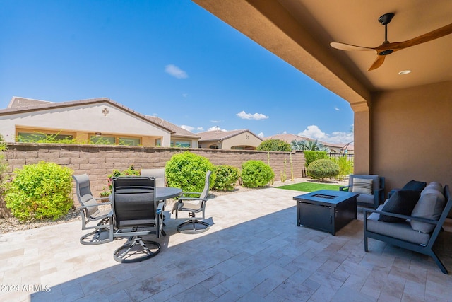 view of patio / terrace featuring ceiling fan