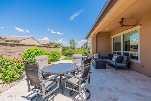 view of patio with ceiling fan and an outdoor hangout area