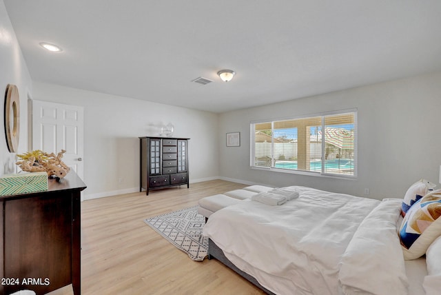 bedroom featuring light hardwood / wood-style floors