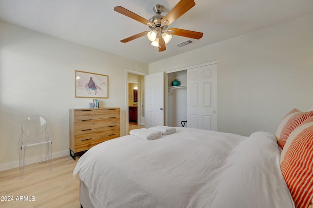 bedroom featuring light wood-type flooring, a closet, and ceiling fan