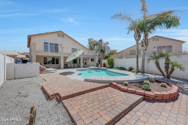 view of swimming pool with a patio