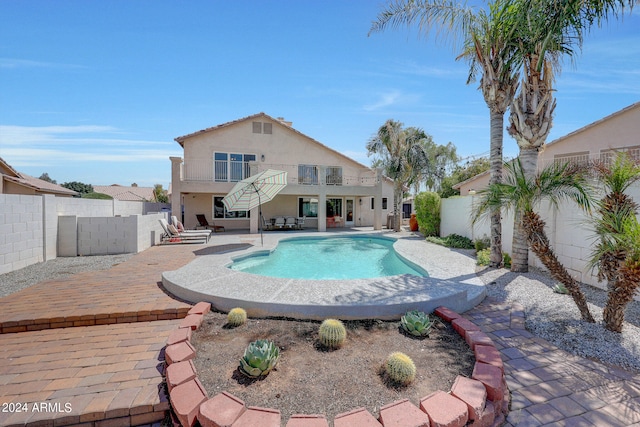 view of swimming pool with a patio