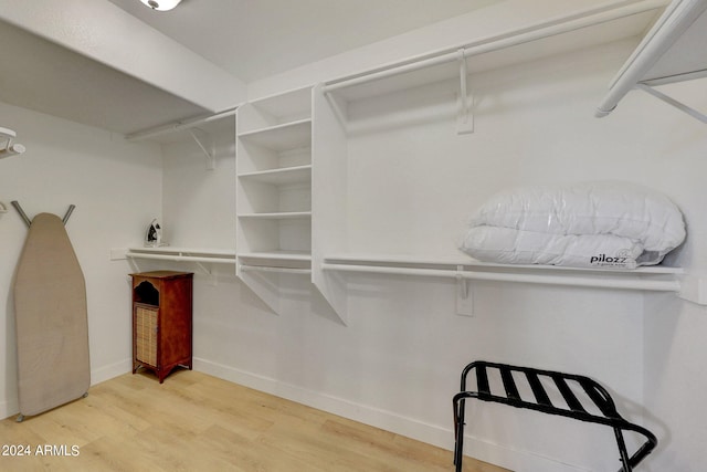 walk in closet featuring hardwood / wood-style floors