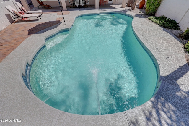 view of pool featuring a patio