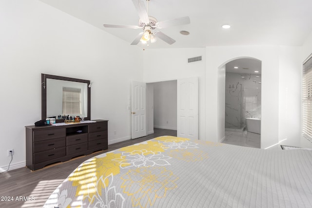 bedroom with hardwood / wood-style floors, ensuite bathroom, ceiling fan, and lofted ceiling