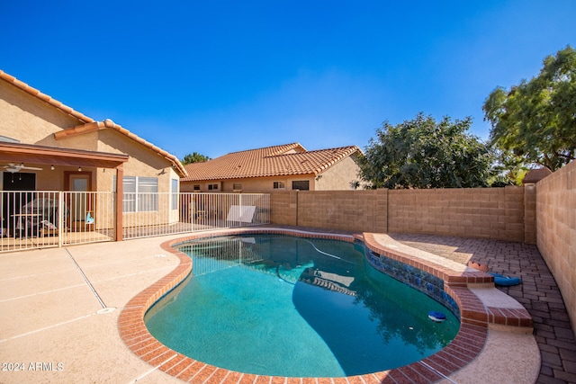 view of swimming pool with a patio area