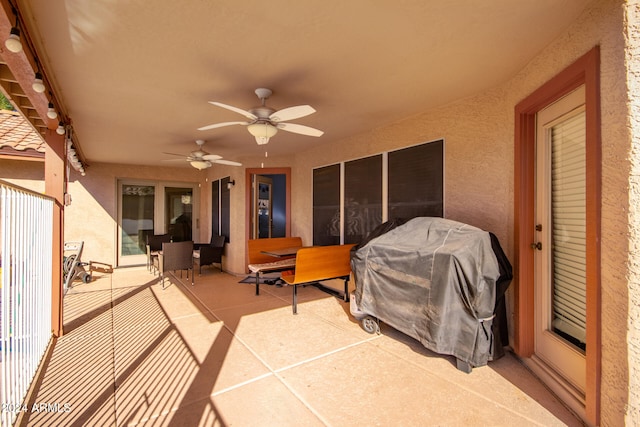 view of patio / terrace with ceiling fan and a grill