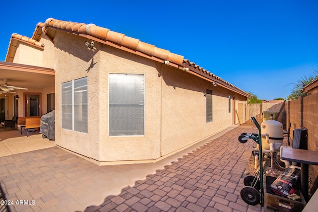 view of side of property with a patio