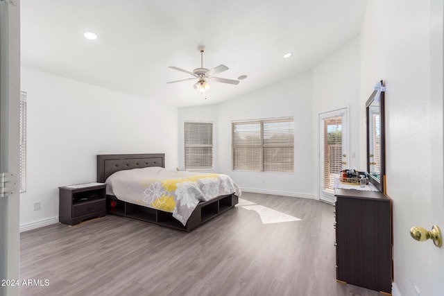 bedroom featuring ceiling fan, lofted ceiling, access to outside, and light hardwood / wood-style flooring