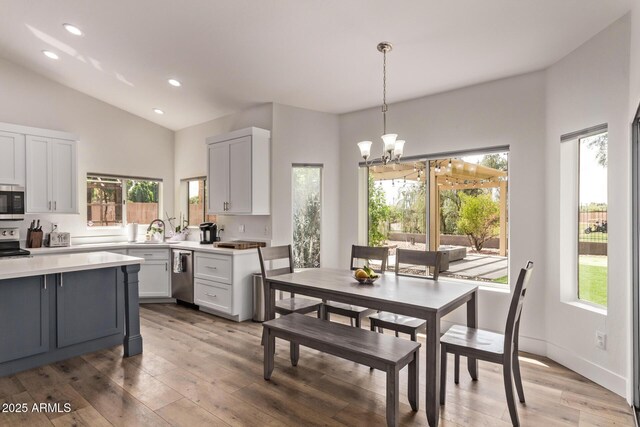 1777 W Redfield Rd, Gilbert, AZ 85233 - kitchen featuring an inviting chandelier, stainless steel appliances, light countertops, lofted ceiling, and recessed lighting