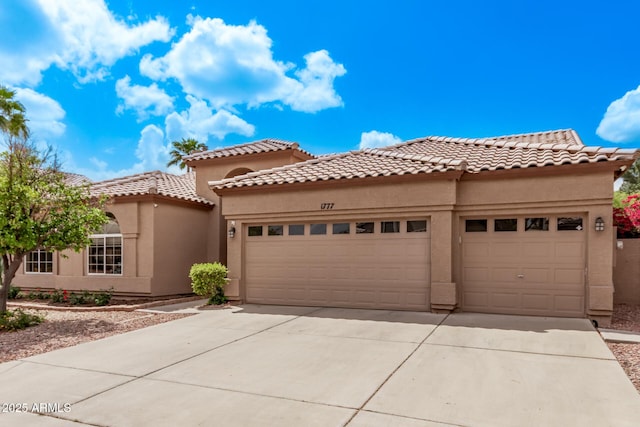 1777 W Redfield Rd, Gilbert, AZ 85233 - mediterranean / spanish-style house featuring stucco siding, driveway, and a garage