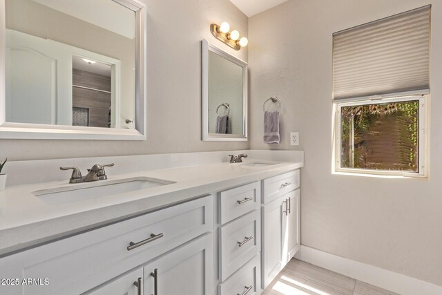 1777 W Redfield Rd, Gilbert, AZ 85233 - full bath with double vanity, baseboards, and a sink
