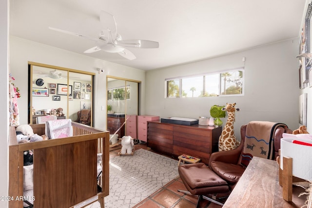 tiled bedroom with ceiling fan