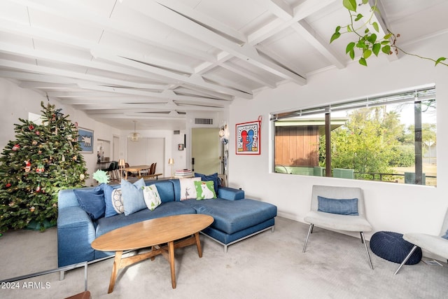 living room featuring beam ceiling and carpet floors