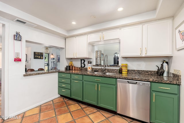 kitchen with white cabinets, a raised ceiling, sink, dark stone countertops, and dishwasher