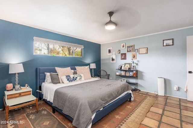 bedroom with ceiling fan and crown molding