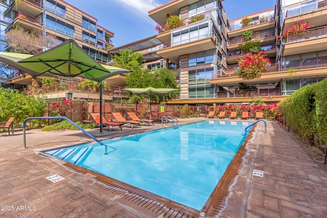 view of pool featuring fence