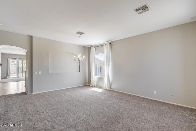 6742 W El Cortez Pl, Peoria, AZ 85383 - unfurnished room featuring carpet floors, a chandelier, arched walkways, and baseboards