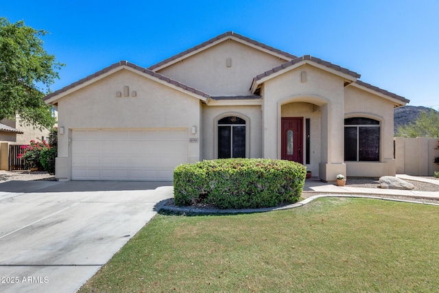 6742 W El Cortez Pl, Peoria, AZ 85383 - mediterranean / spanish home featuring stucco siding, an attached garage, concrete driveway, and a tiled roof