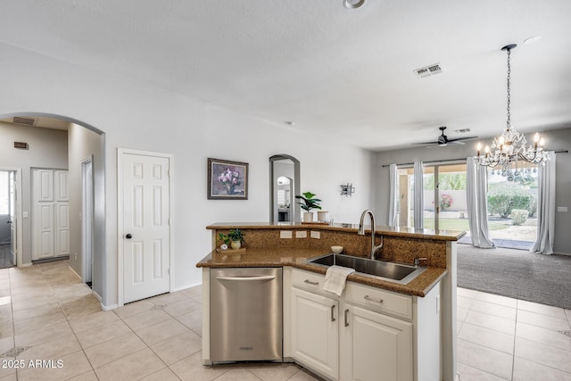 6742 W El Cortez Pl, Peoria, AZ 85383 - kitchen with a sink, arched walkways, light tile patterned floors, ceiling fan, and white cabinets