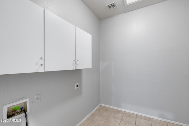 6742 W El Cortez Pl, Peoria, AZ 85383 - washroom featuring cabinet space, hookup for an electric dryer, washer hookup, baseboards, and light tile patterned floors