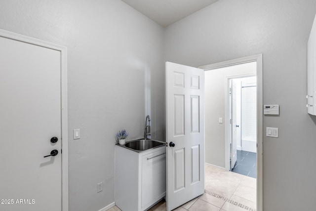 6742 W El Cortez Pl, Peoria, AZ 85383 - laundry room featuring a sink and light tile patterned flooring