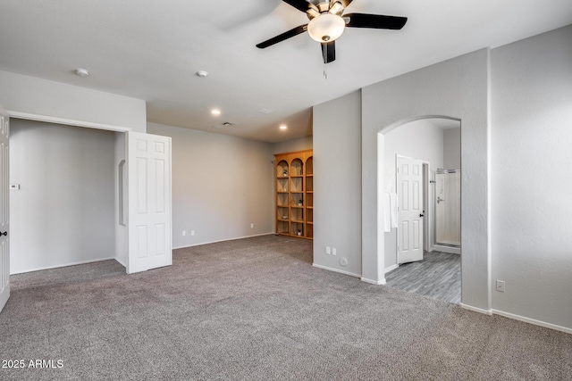 6742 W El Cortez Pl, Peoria, AZ 85383 - unfurnished room featuring a ceiling fan, carpet, arched walkways, baseboards, and recessed lighting