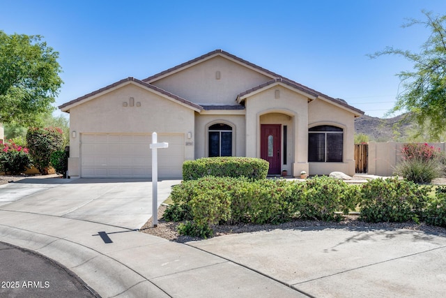 6742 W El Cortez Pl, Peoria, AZ 85383 - mediterranean / spanish home with stucco siding, a garage, and driveway