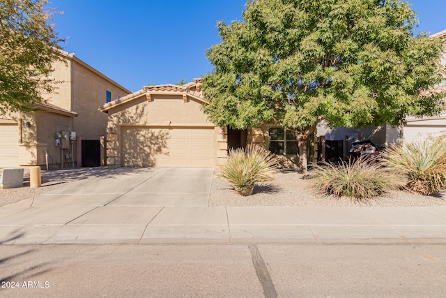 view of front of property with a garage