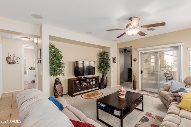 living room with ceiling fan and light tile patterned floors