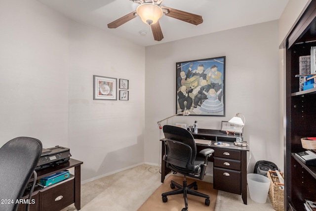 carpeted office space featuring ceiling fan