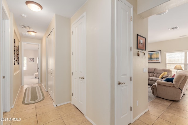 hallway with light tile patterned flooring