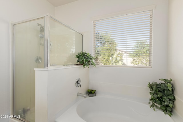 bathroom with independent shower and bath