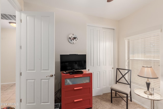 living area with light colored carpet