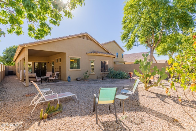 back of property featuring a patio