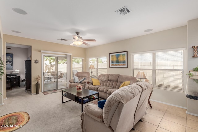 tiled living room with ceiling fan