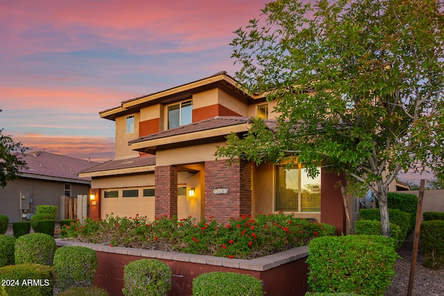 prairie-style house featuring a garage