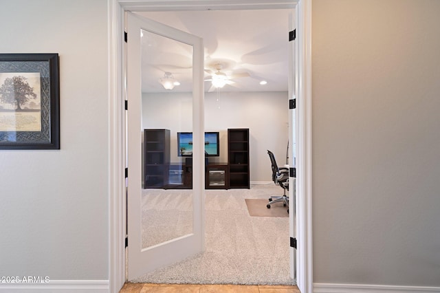 carpeted home office with french doors, baseboards, and ceiling fan