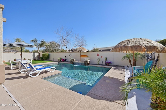 view of pool featuring a patio, a fenced backyard, and a fenced in pool