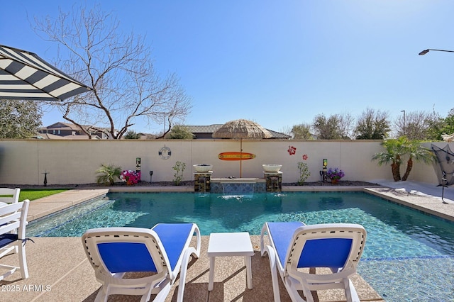 view of swimming pool featuring a fenced in pool and a fenced backyard