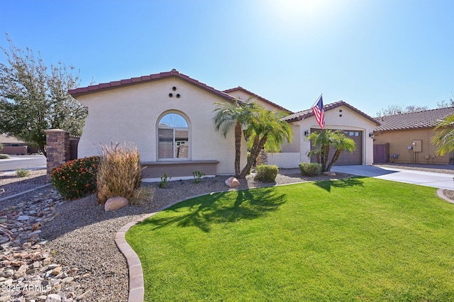 mediterranean / spanish-style home with stucco siding, a front lawn, concrete driveway, an attached garage, and a tiled roof