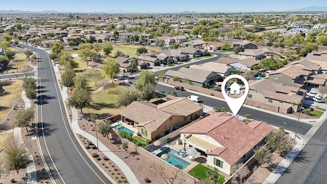 birds eye view of property with a residential view