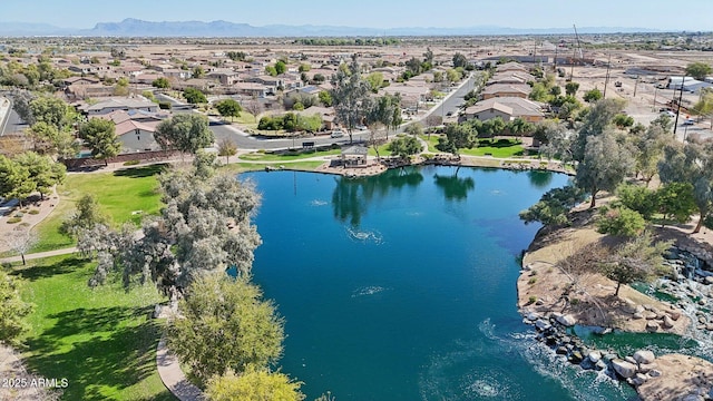 drone / aerial view with a residential view and a water view