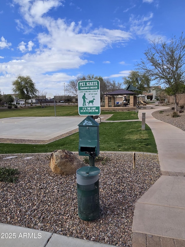 view of property's community with a lawn