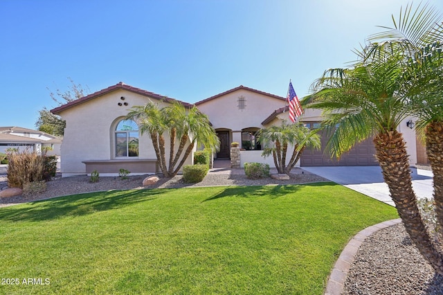 mediterranean / spanish home featuring stucco siding, an attached garage, concrete driveway, and a front yard