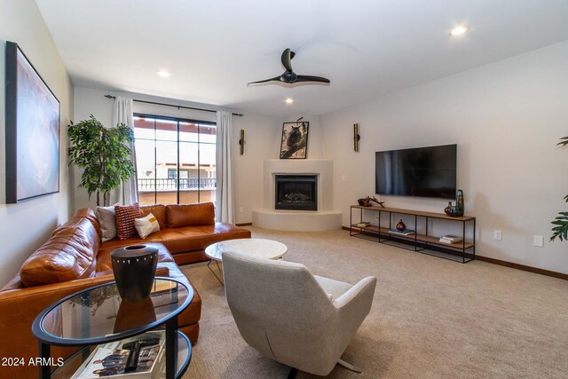 living room with light carpet and ceiling fan