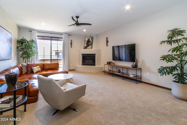 carpeted living room featuring ceiling fan