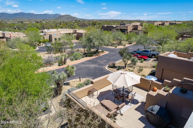 birds eye view of property with a mountain view