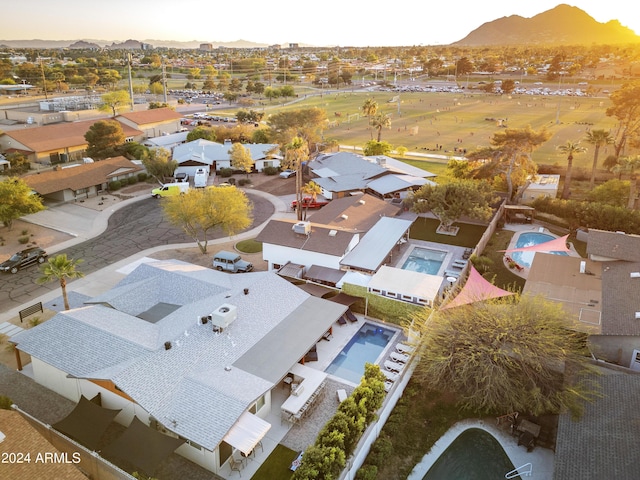 birds eye view of property with a residential view and a mountain view