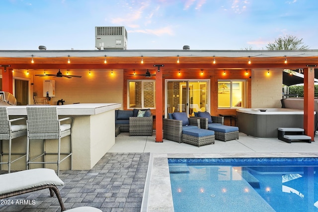 pool with a patio area, an outdoor hangout area, outdoor dry bar, and central AC
